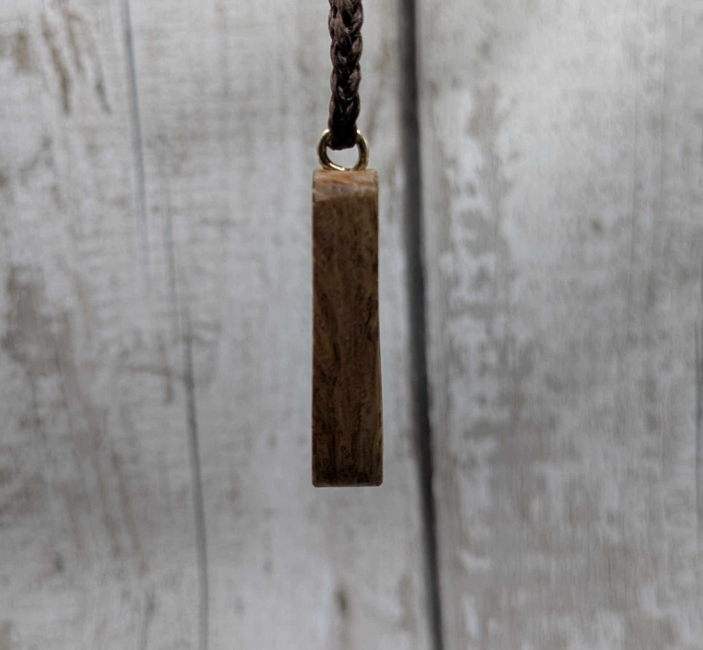 Olive wood berkana rune pendant.
