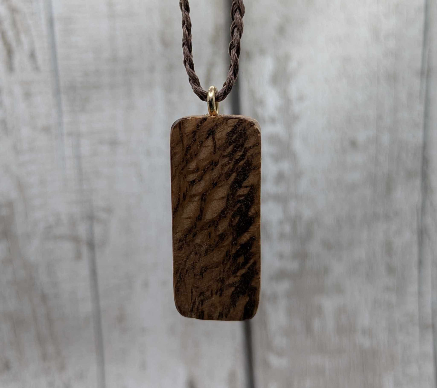 Olive wood berkana rune pendant.