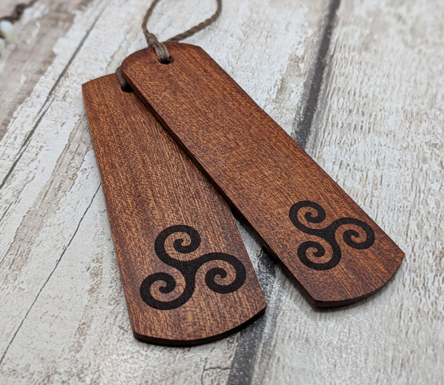 Walnut wood hand made bookmark with triskele laser print.
