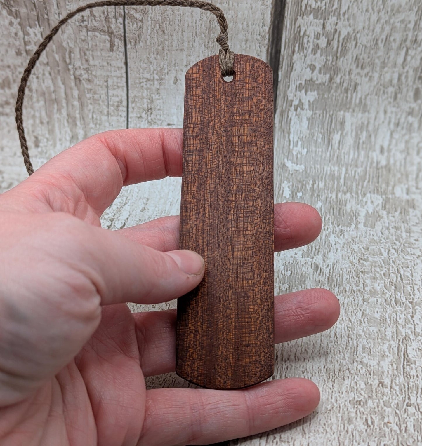 Walnut wood hand made bookmark with triskele laser print.