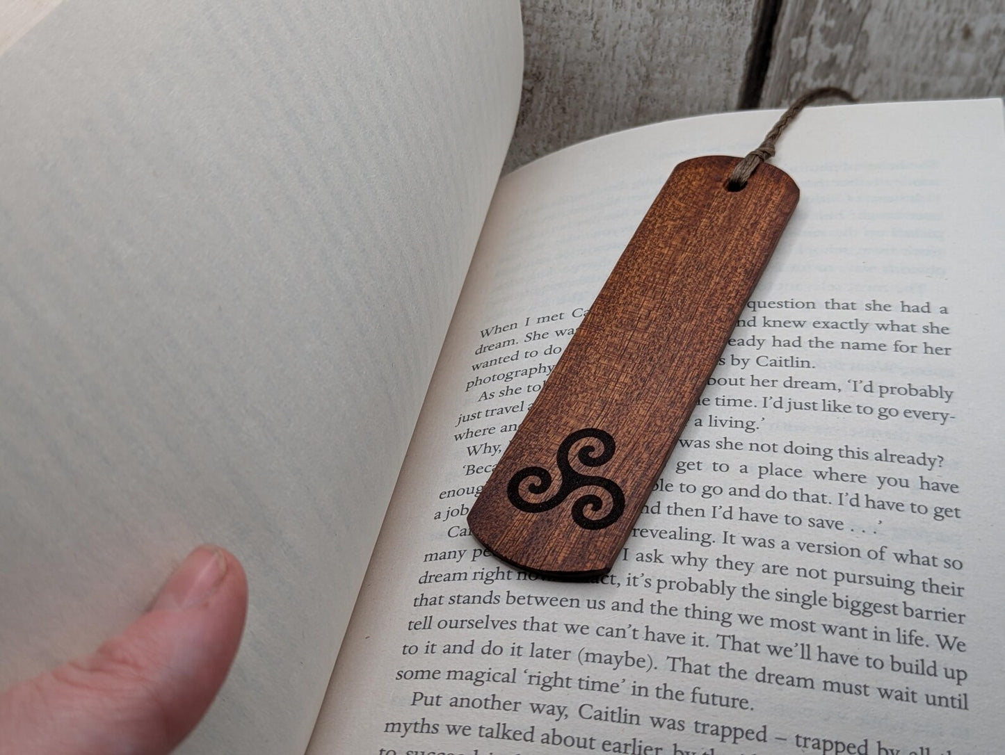 Walnut wood hand made bookmark with triskele laser print.