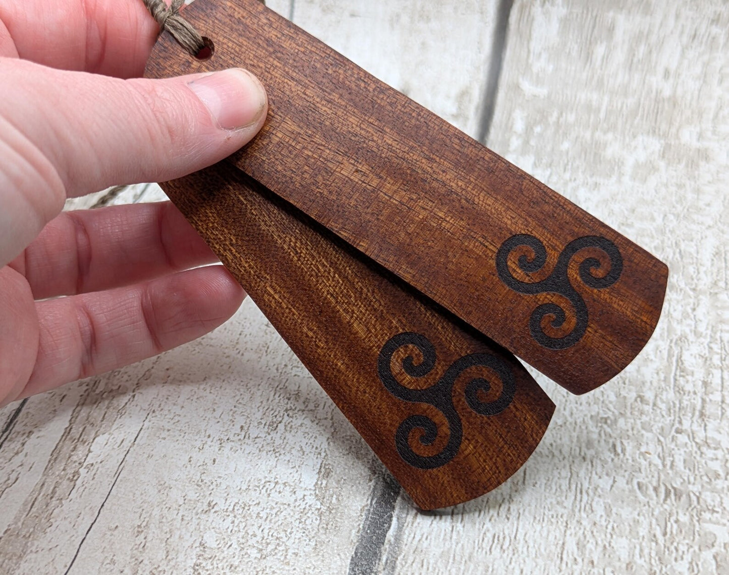 Walnut wood hand made bookmark with triskele laser print.