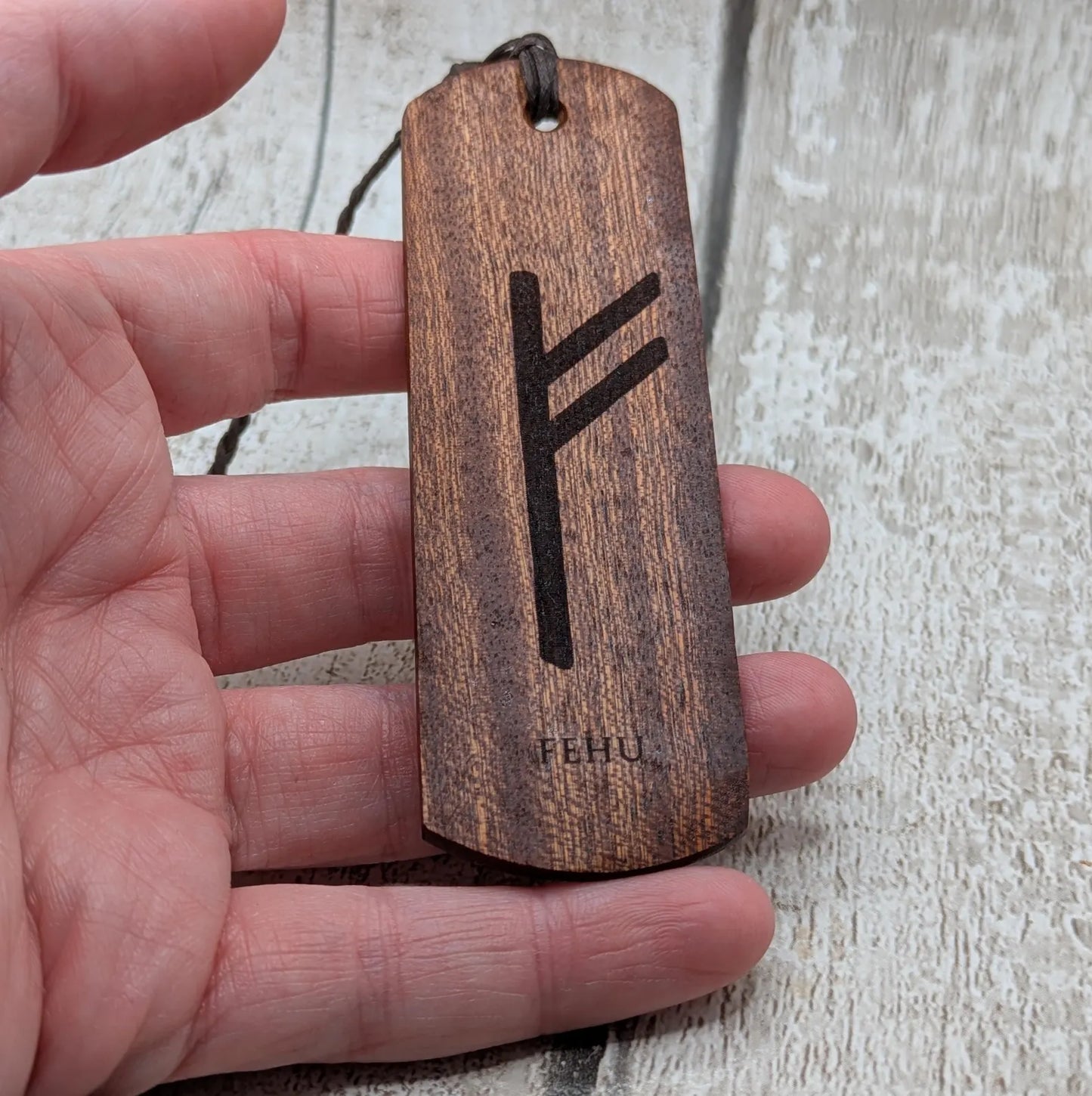 Walnut wood handmade bookmark with fehu Norse rune laser print.