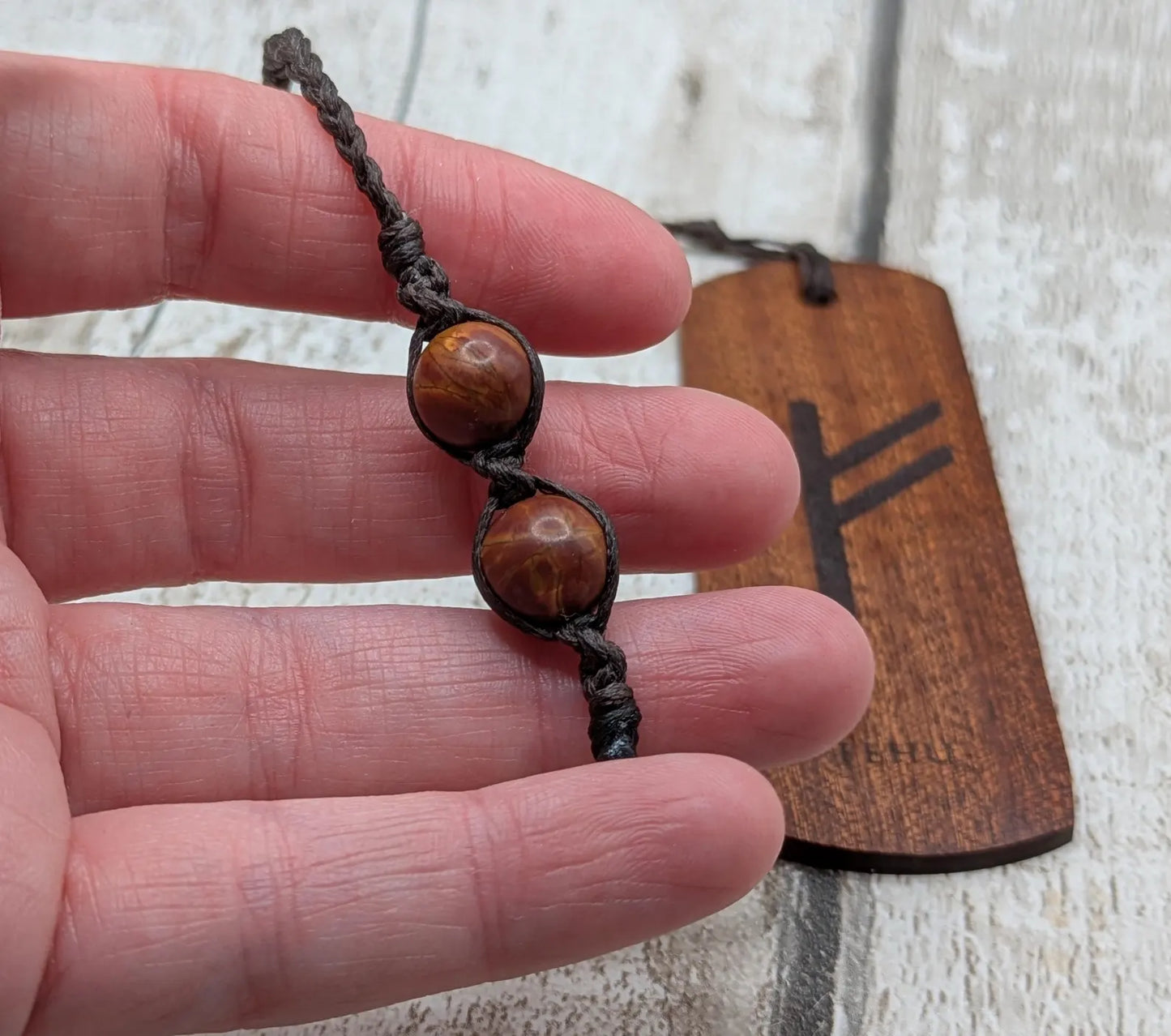 Walnut wood handmade bookmark with fehu Norse rune laser print.