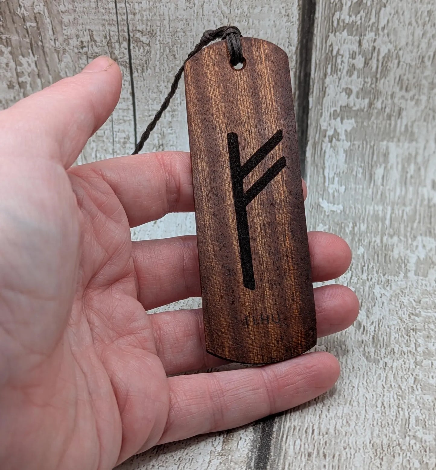 Walnut wood handmade bookmark with fehu Norse rune laser print.