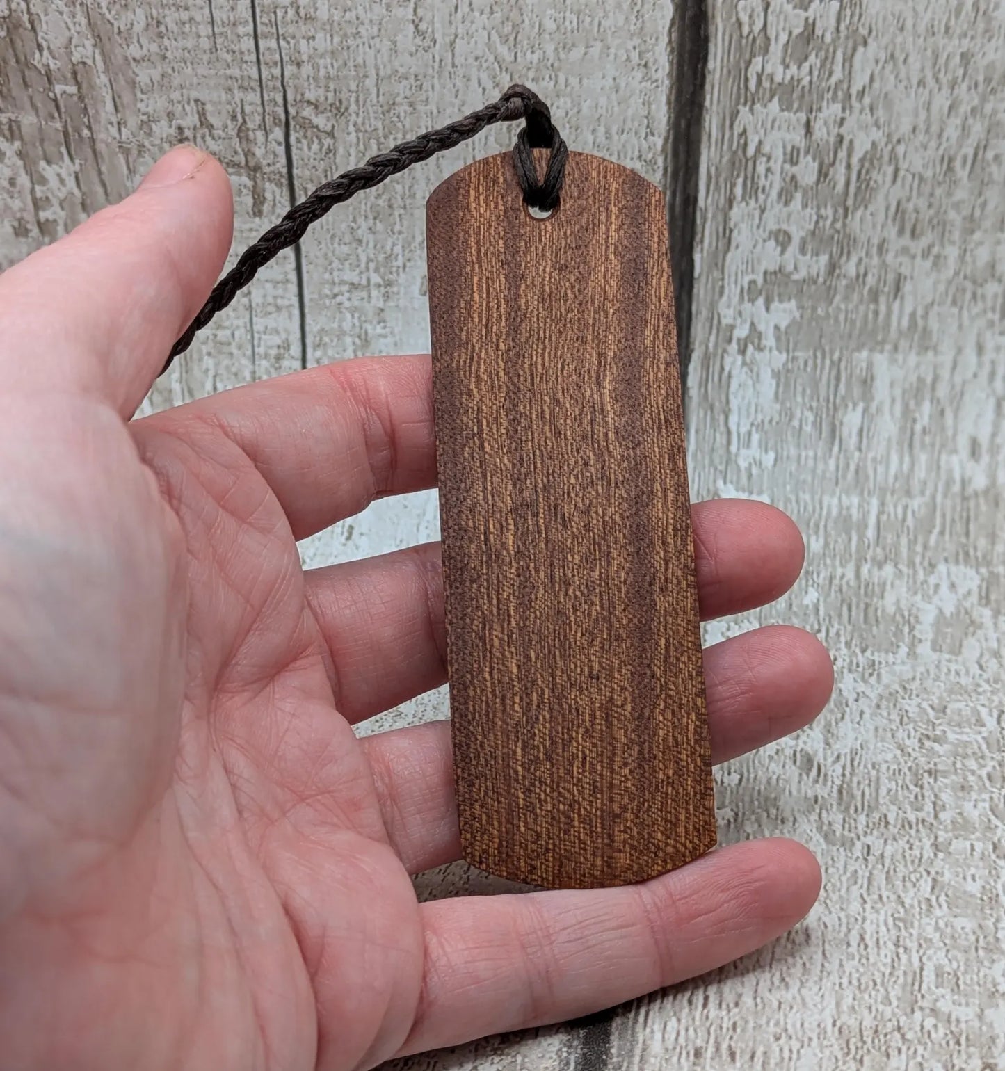 Walnut wood handmade bookmark with fehu Norse rune laser print.