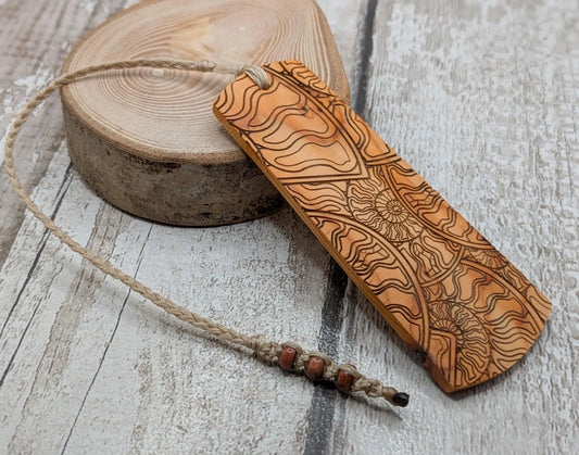 Yew wood handmade bookmark with ammonite laser print image.