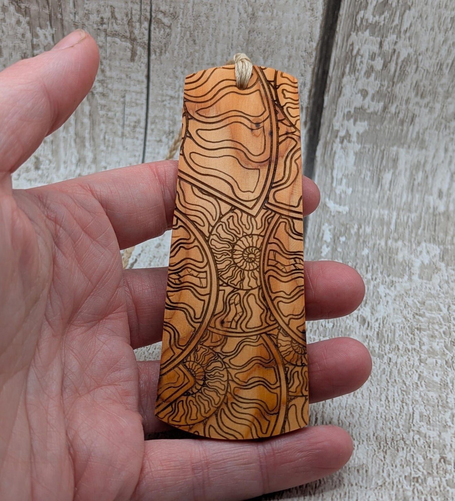 Yew wood handmade bookmark with ammonite laser print image.