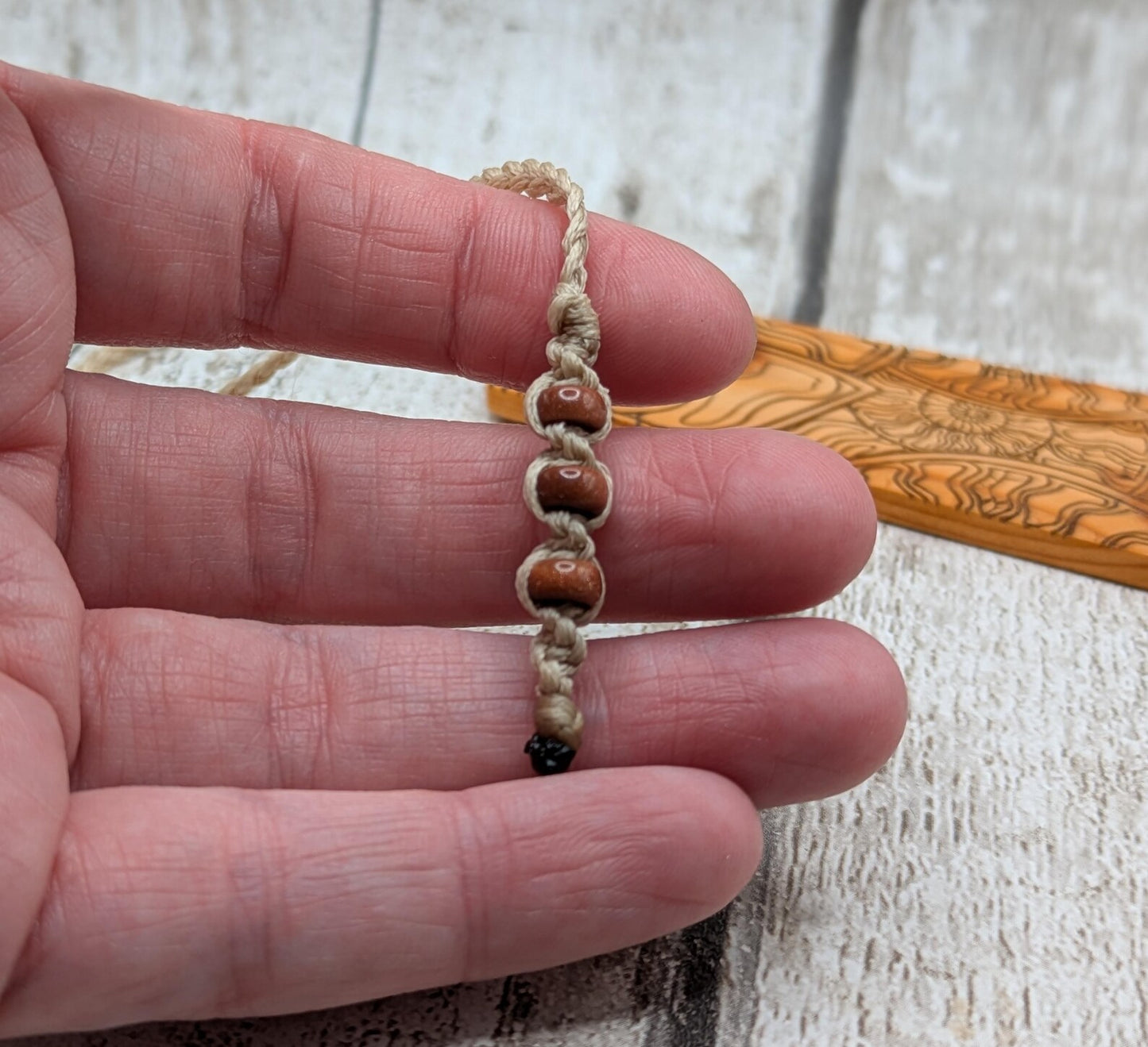 Yew wood handmade bookmark with ammonite laser print image.