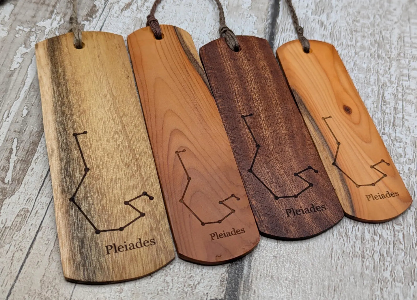 Laburnum wood hand made bookmark with Pleiades constellation laser print.