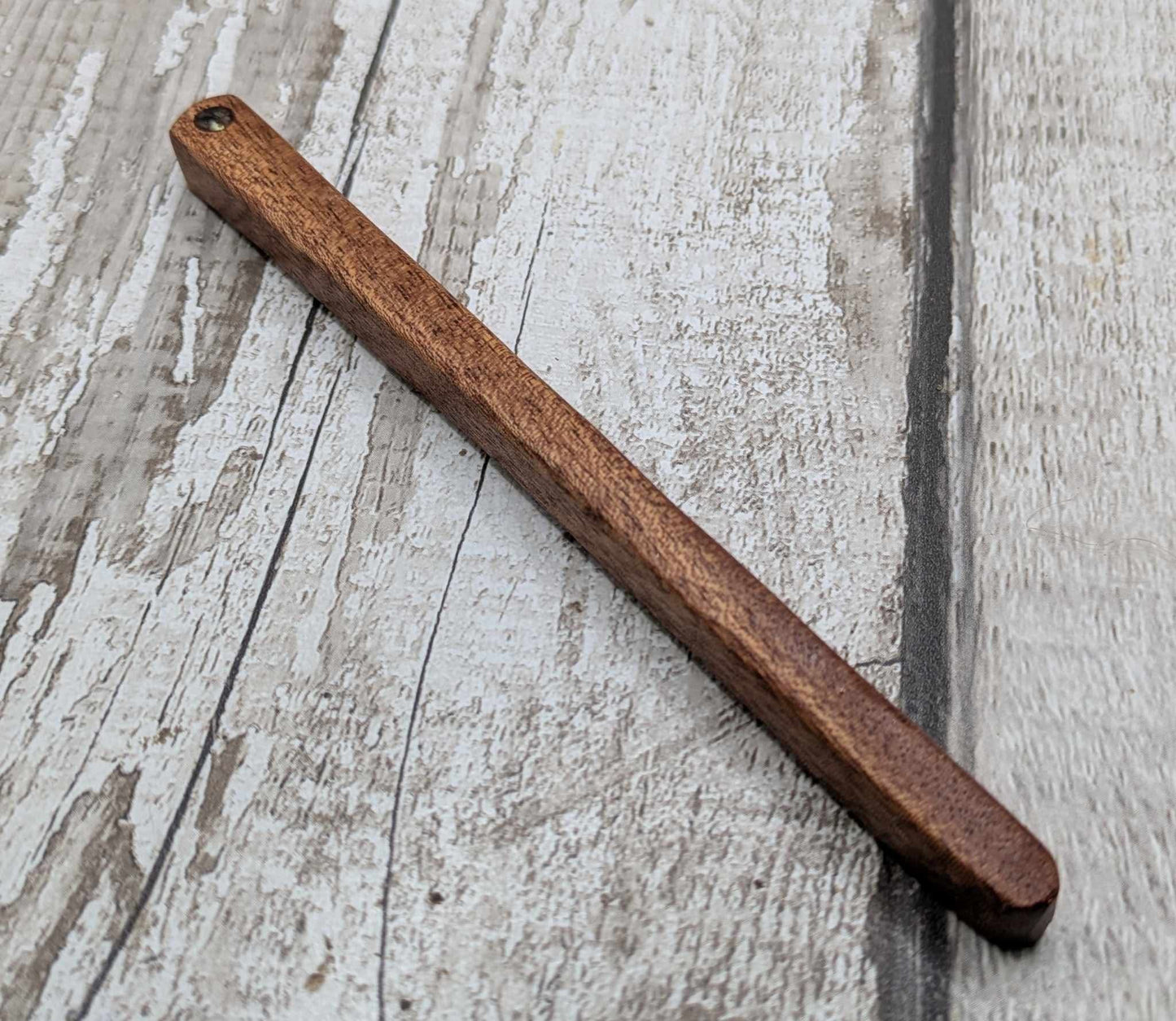 Sepele mahogany wod hair pin with abalone shell.