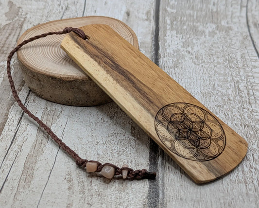 Laburnum wood hand made bookmark with geometric laser pattern.