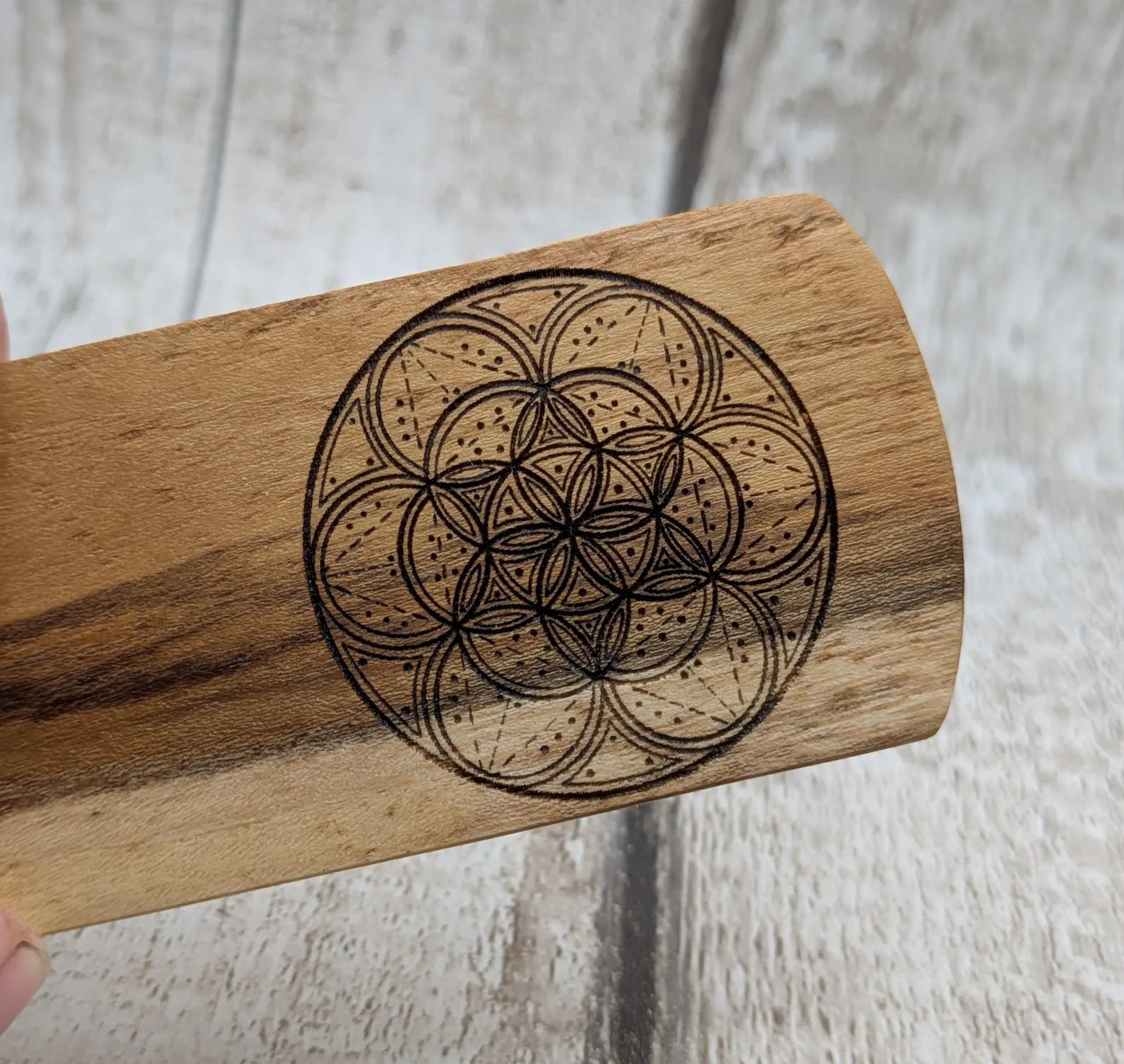 Laburnum wood hand made bookmark with geometric laser pattern.