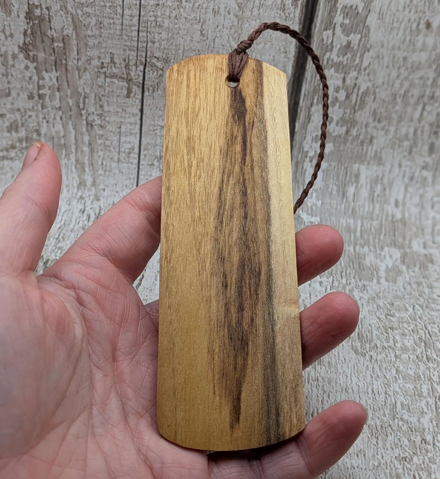 Laburnum wood hand made bookmark with geometric laser pattern.