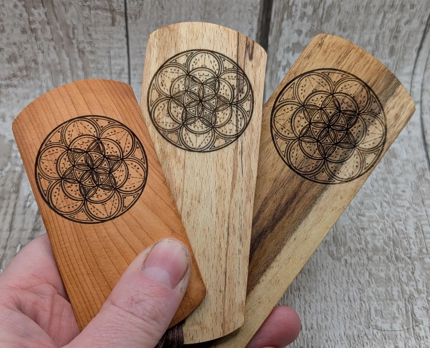 Laburnum wood hand made bookmark with geometric laser pattern.