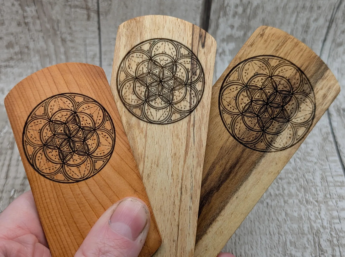 Laburnum wood hand made bookmark with geometric laser pattern.