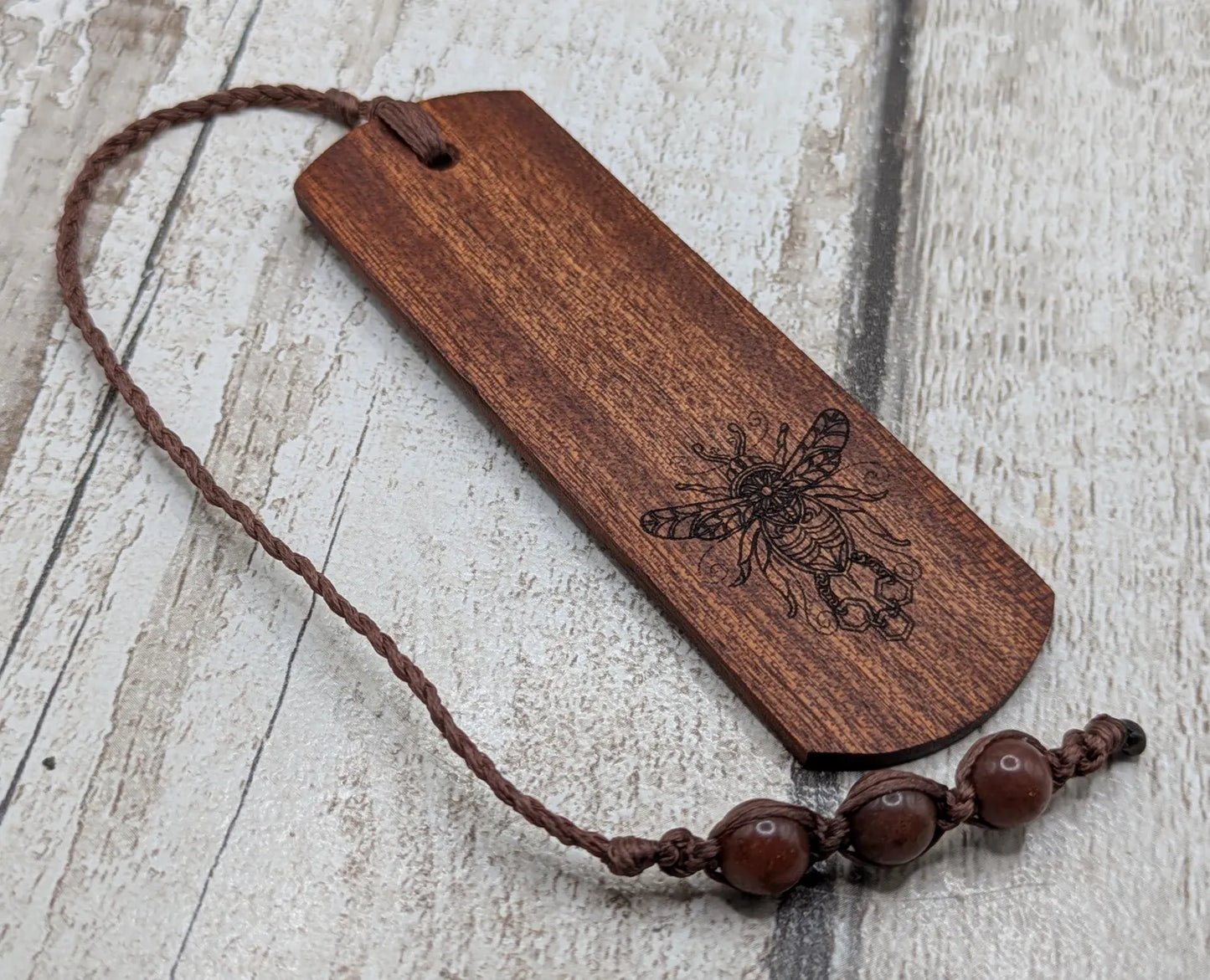 Walnut wood hand made bookmark with laser printed bumble bee design.