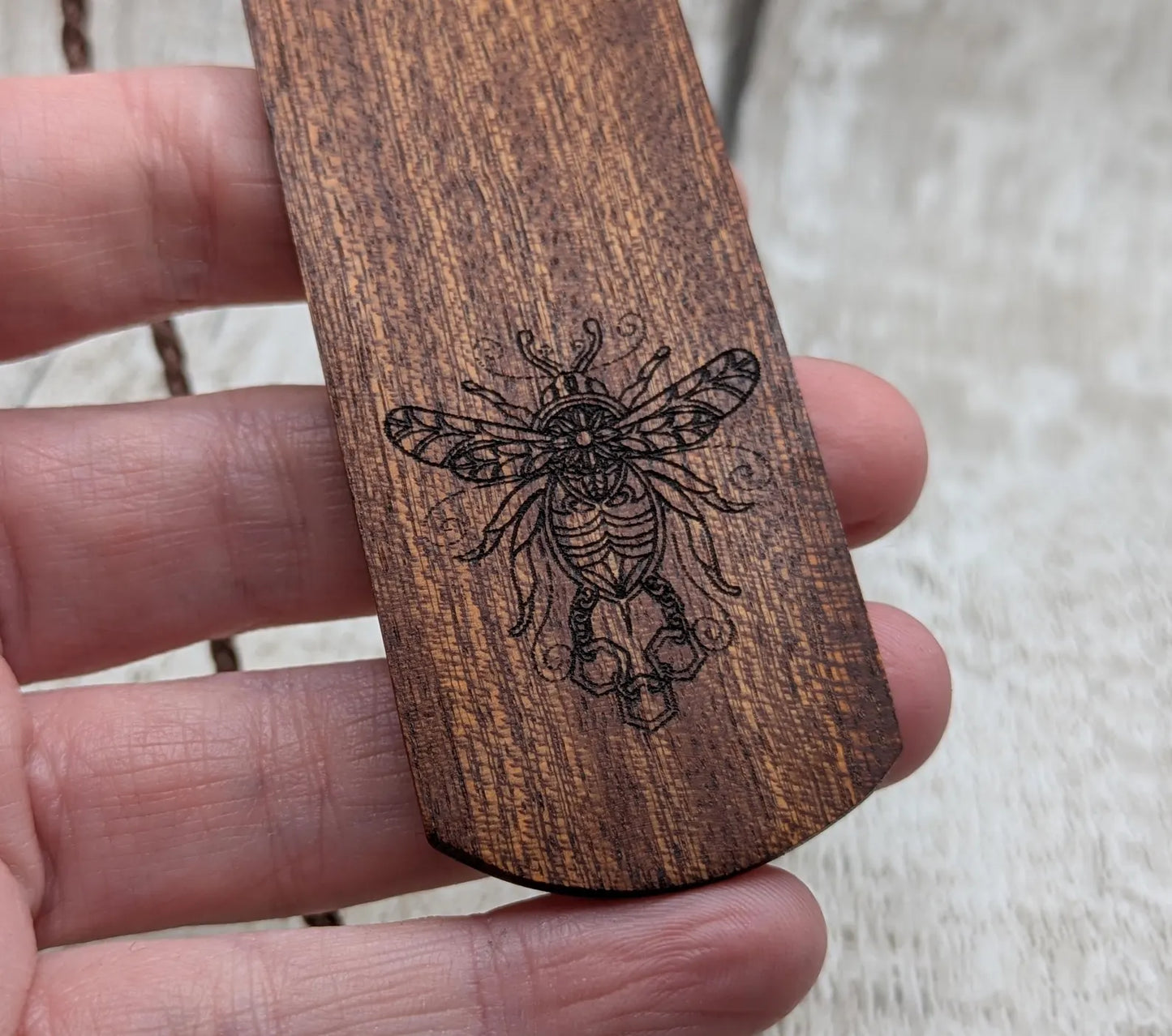 Walnut wood hand made bookmark with laser printed bumble bee design.