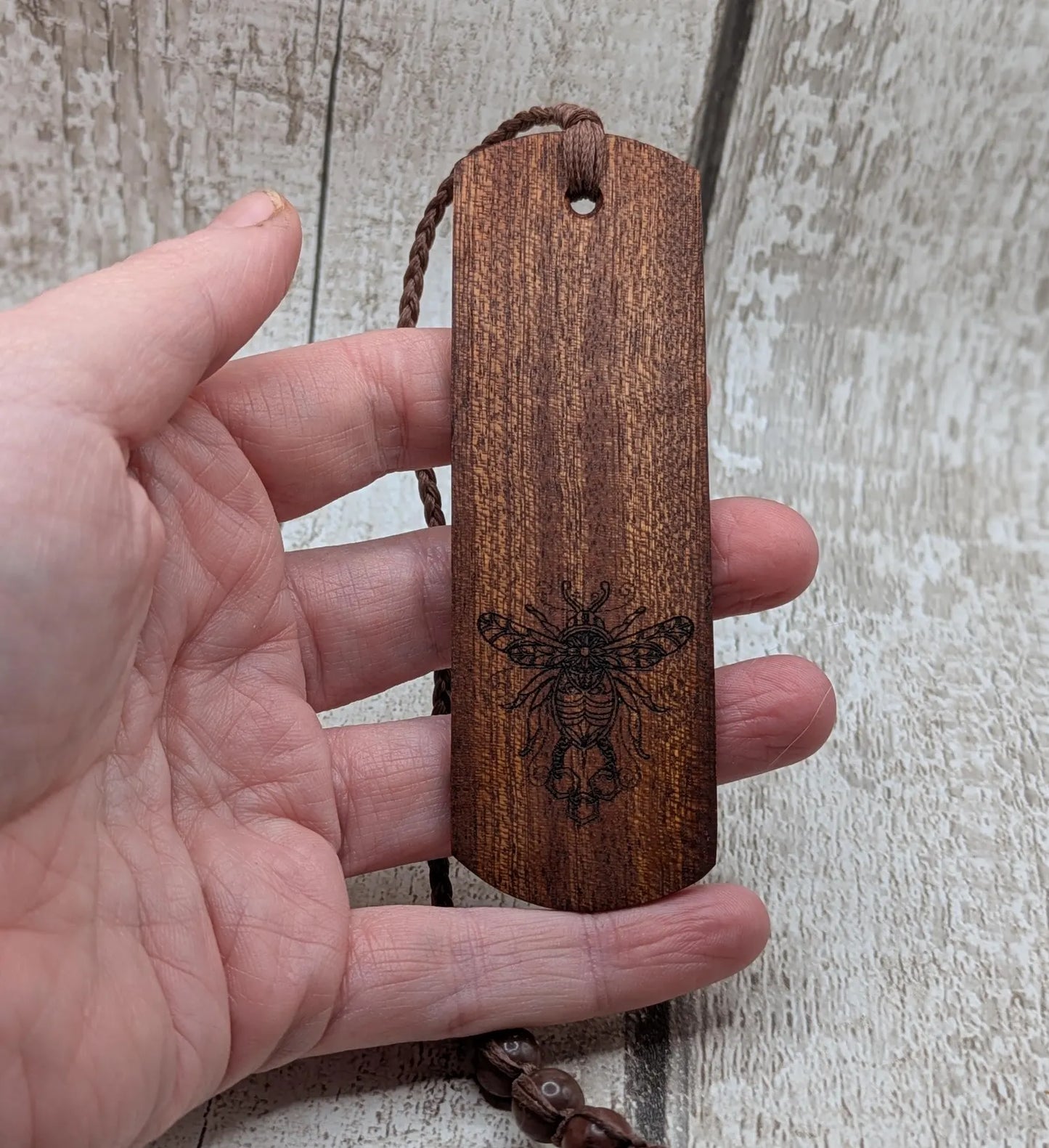 Walnut wood hand made bookmark with laser printed bumble bee design.