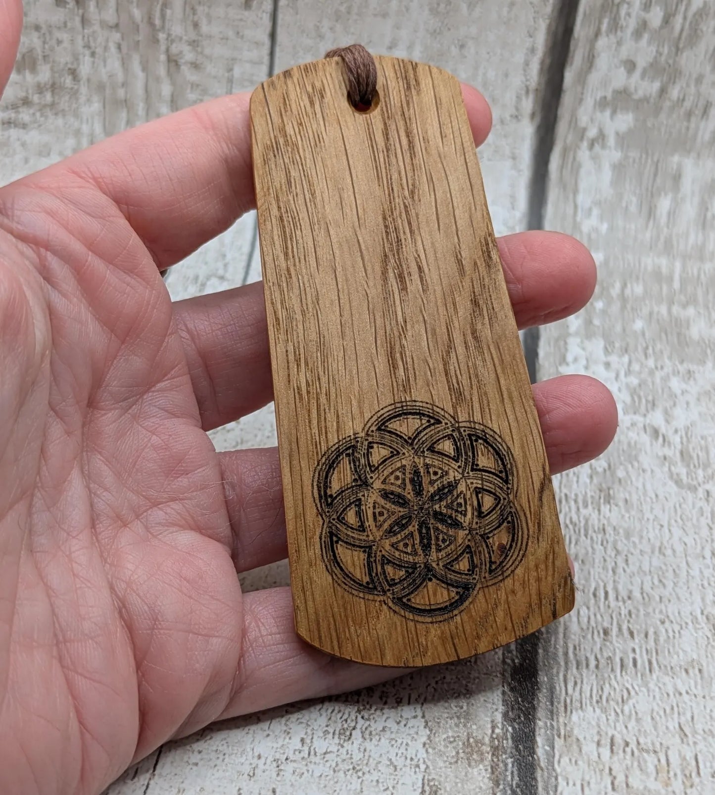Oak wood hand made bookmark with a geometric laser print.