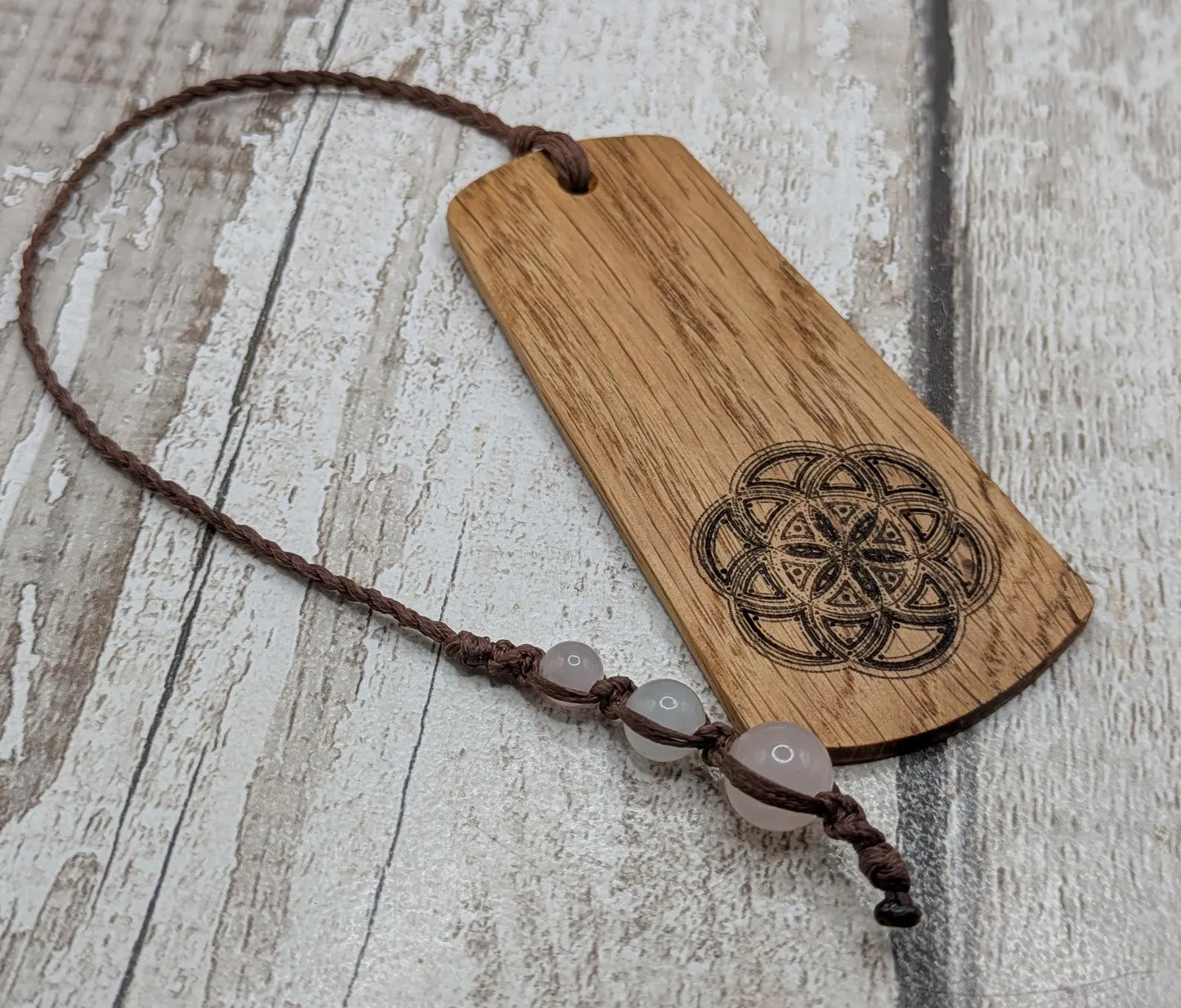 Oak wood hand made bookmark with a geometric laser print.