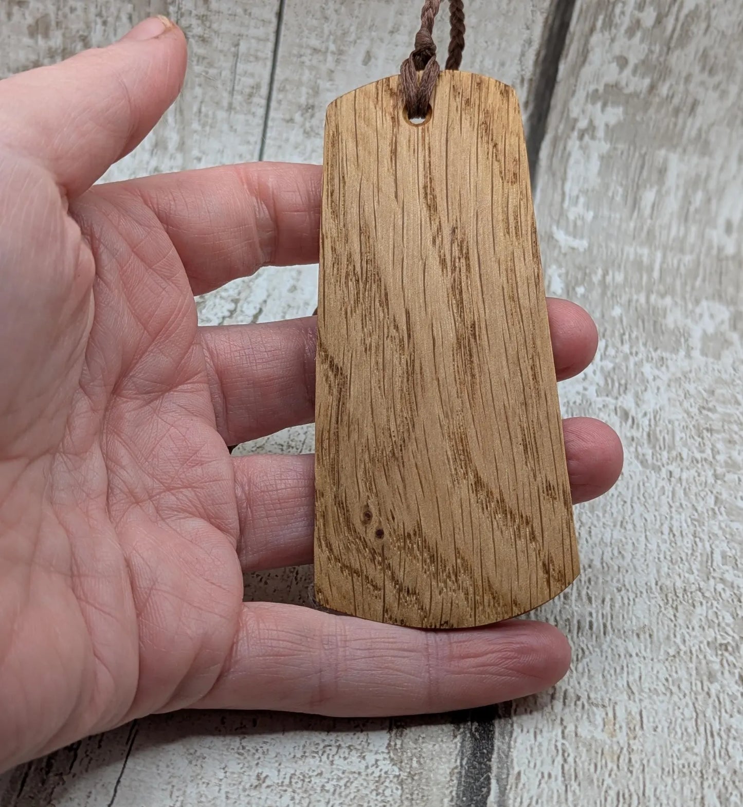 Oak wood hand made bookmark with a geometric laser print.