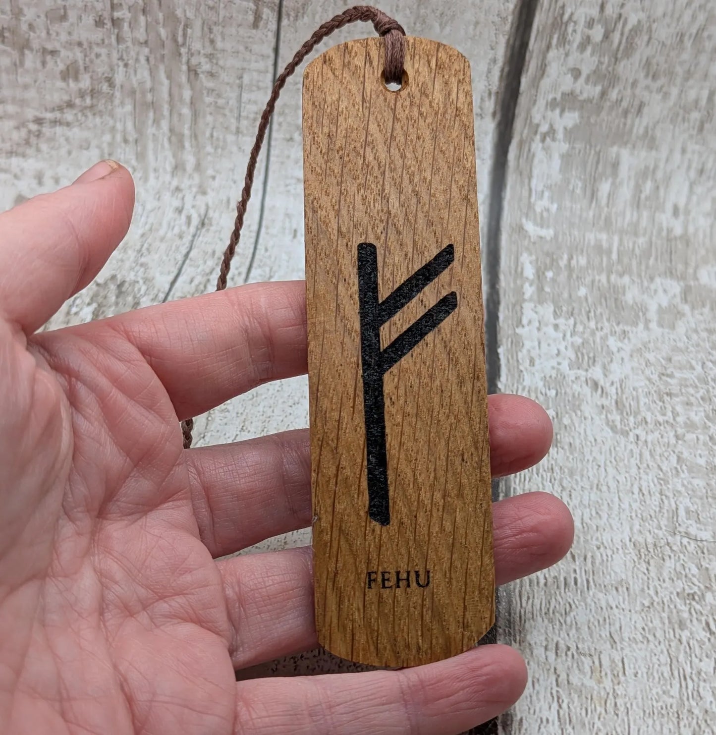 Handmade oak wood fehu rune bookmark.