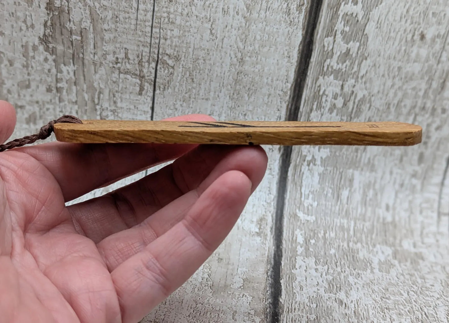Handmade oak wood fehu rune bookmark.