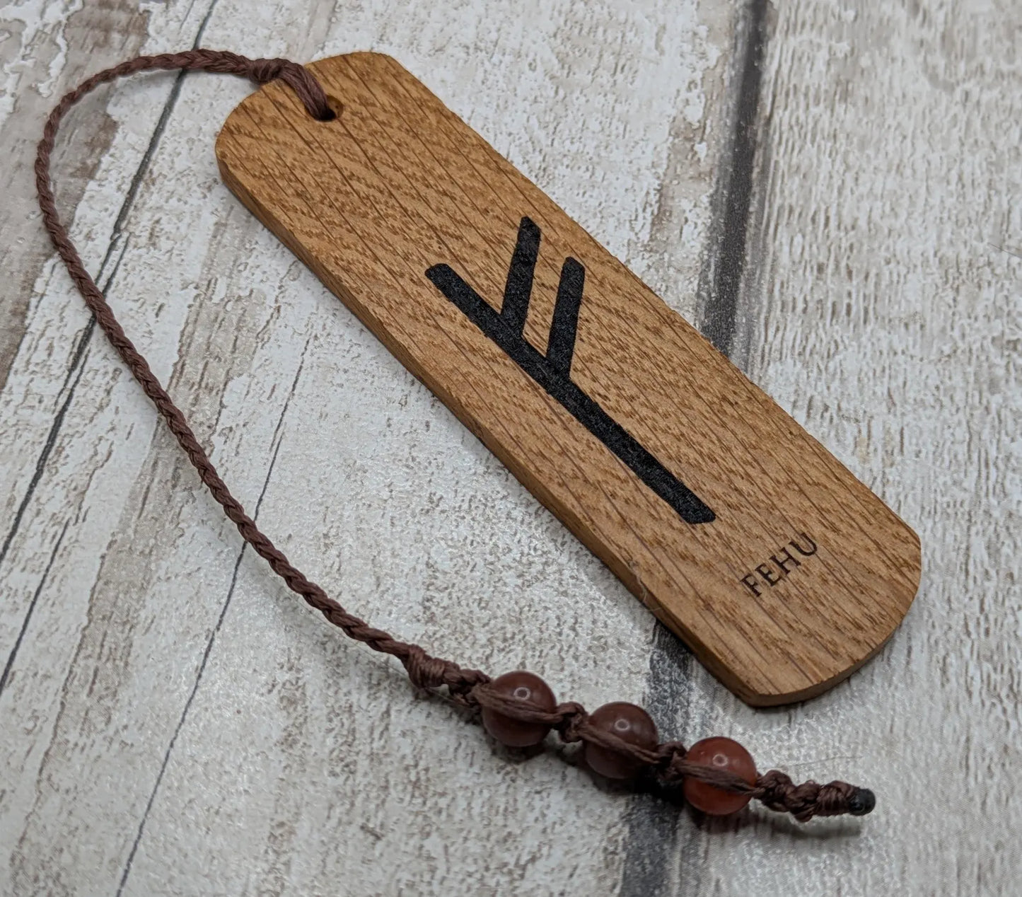 Handmade oak wood fehu rune bookmark.