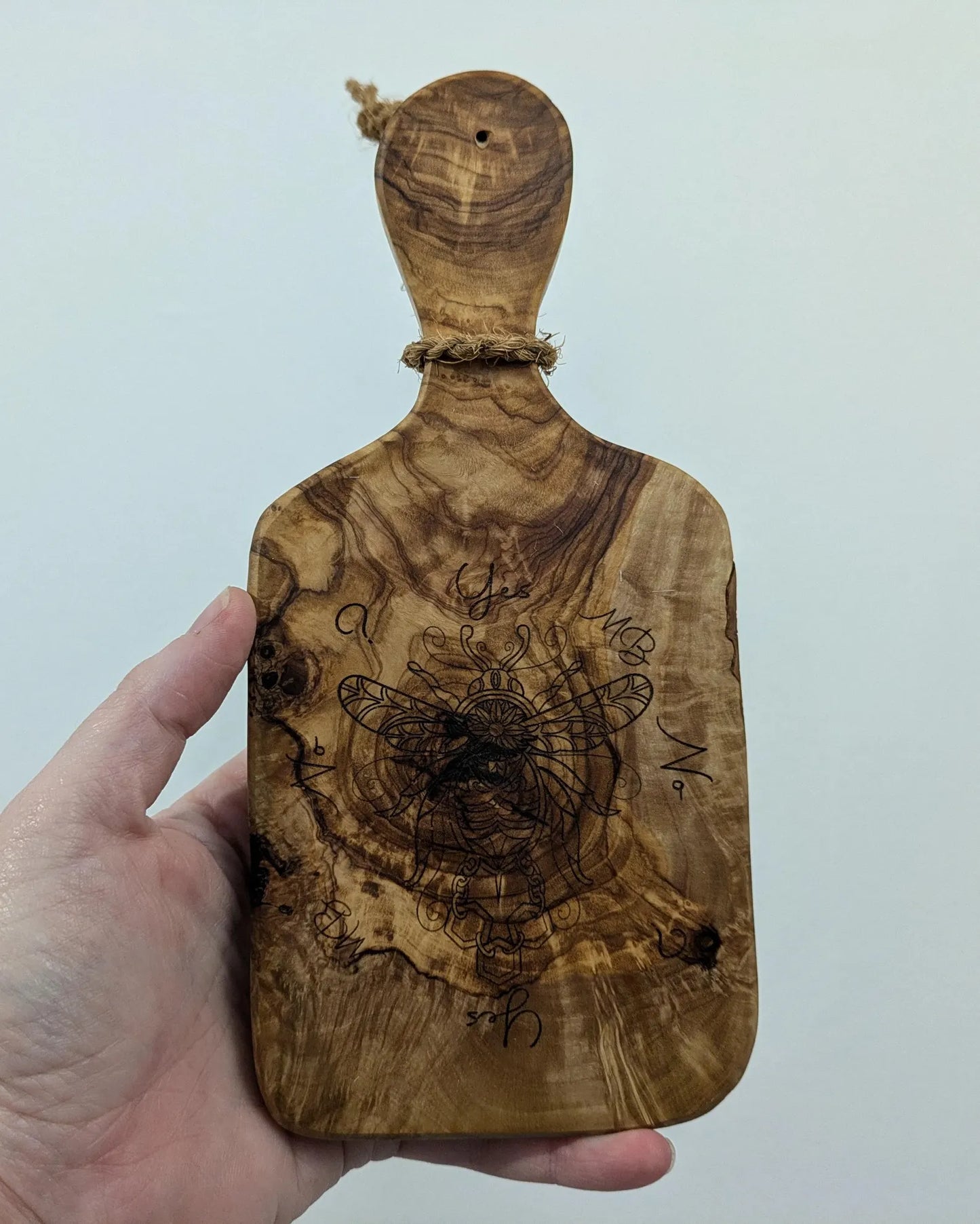 Olive wood bumble bee pendulum dowsing board with incense stick holder.