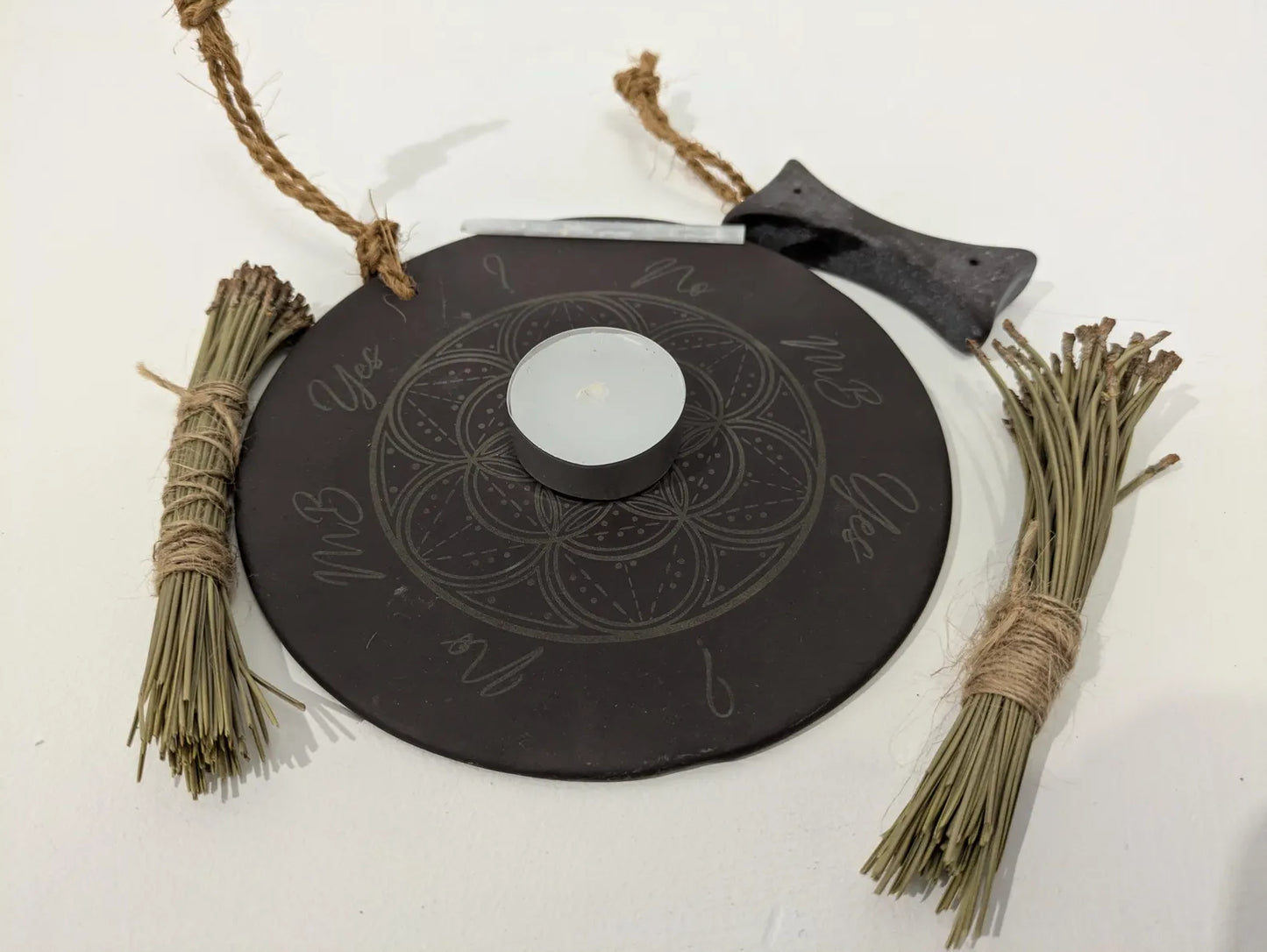 Welsh slate geometric print pendulum dowsing board with incense holder.