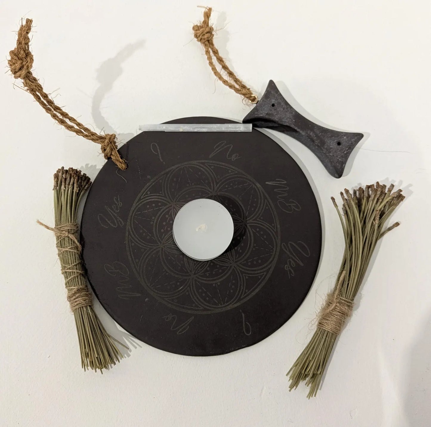 Welsh slate geometric print pendulum dowsing board with incense holder.