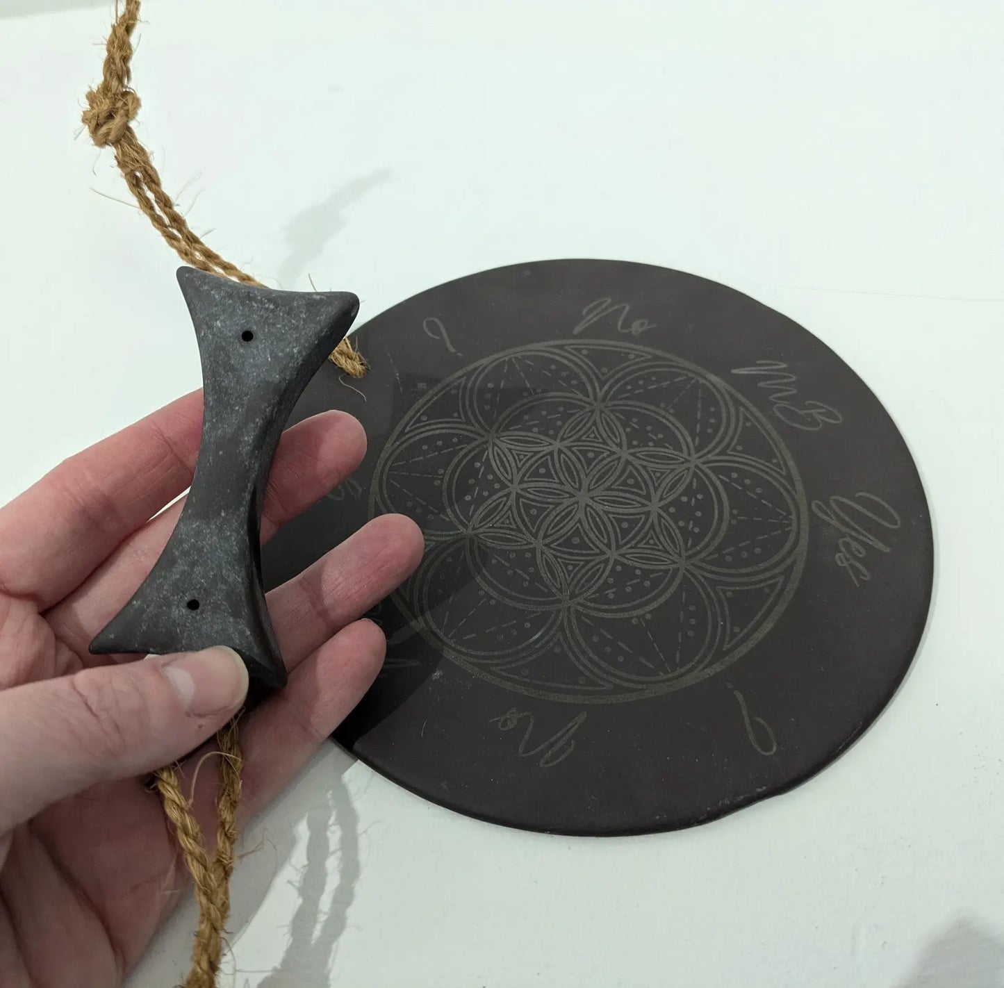 Welsh slate geometric print pendulum dowsing board with incense holder.