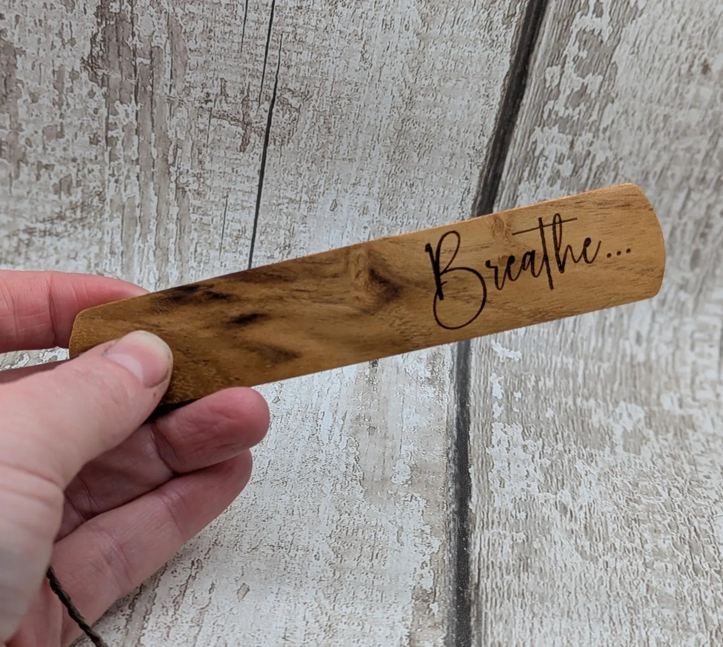 Handmade alder wooden laser printed breathe bookmark.