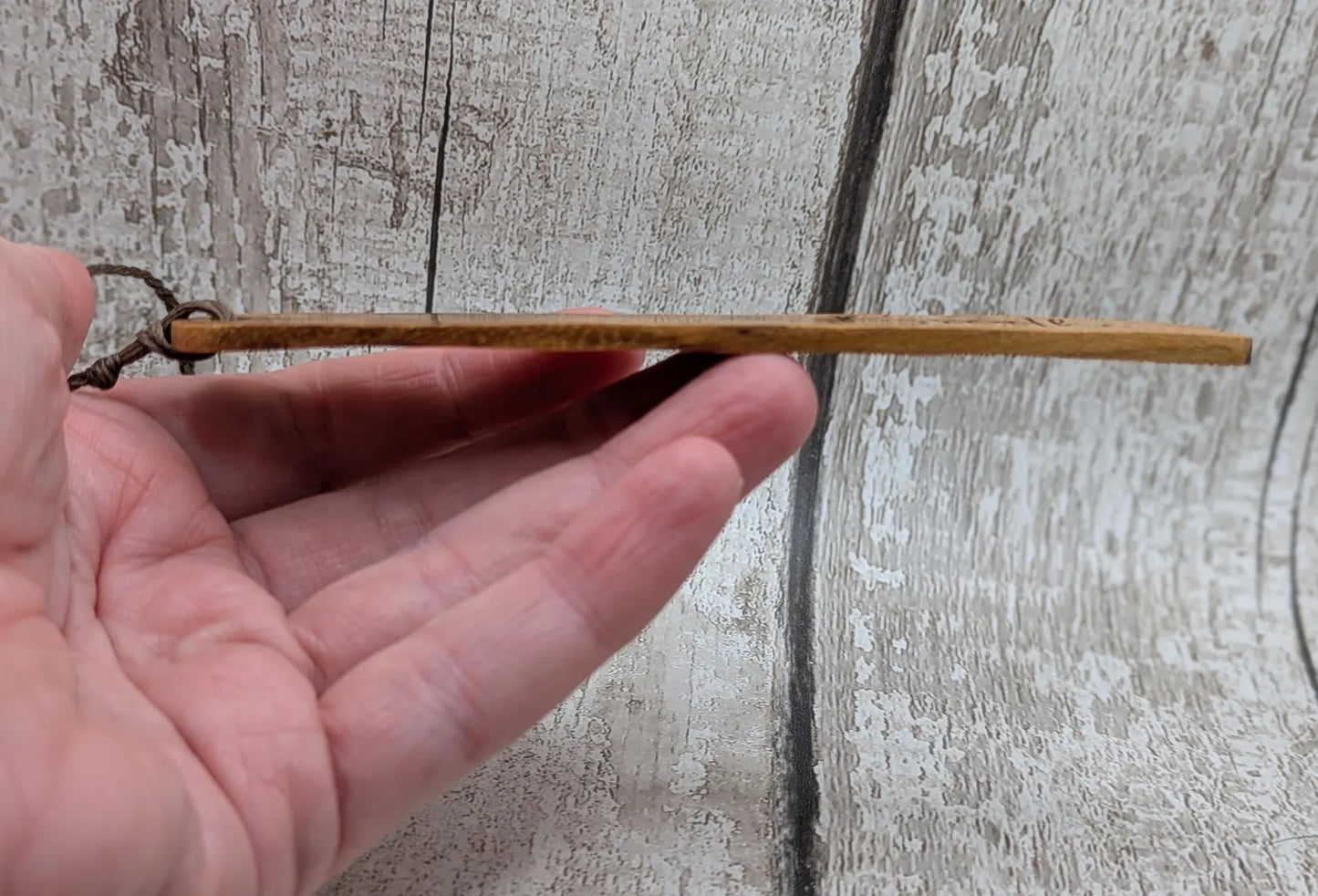 Handmade alder wooden laser printed breathe bookmark.