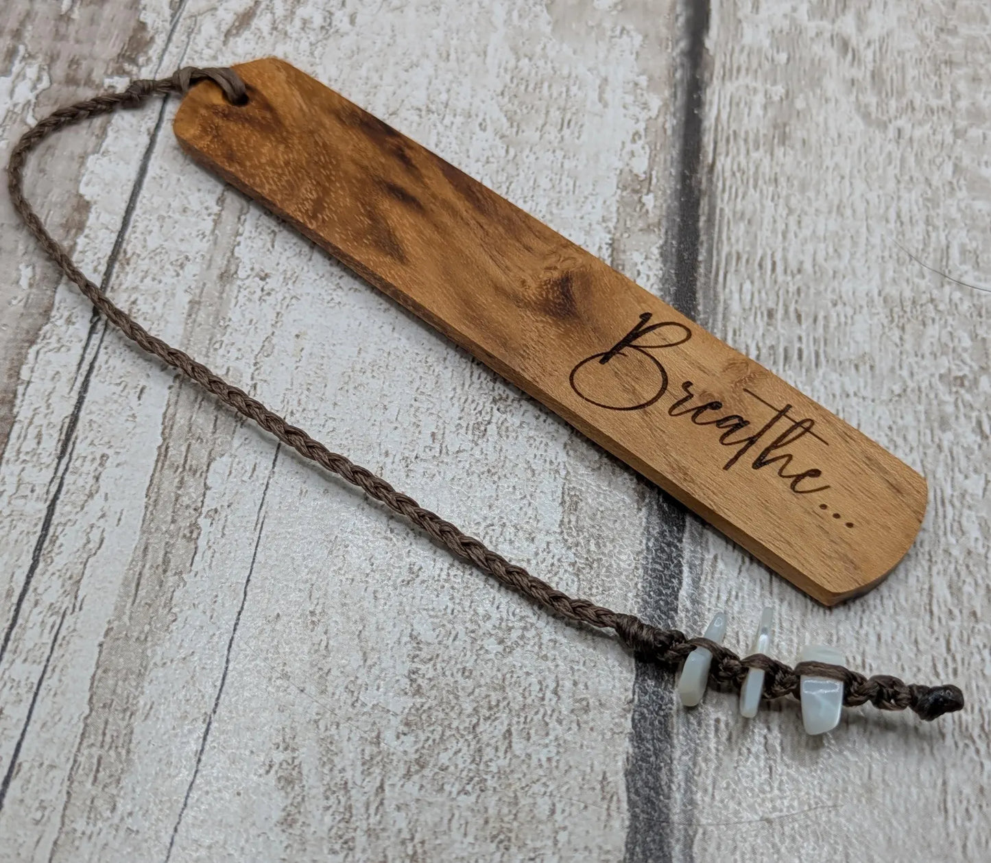 Handmade alder wooden laser printed breathe bookmark.