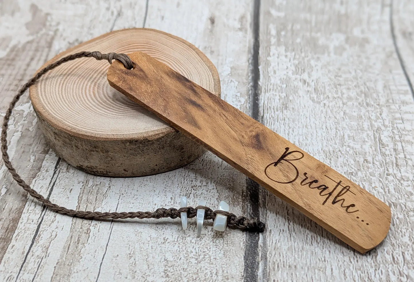 Handmade alder wooden laser printed breathe bookmark.