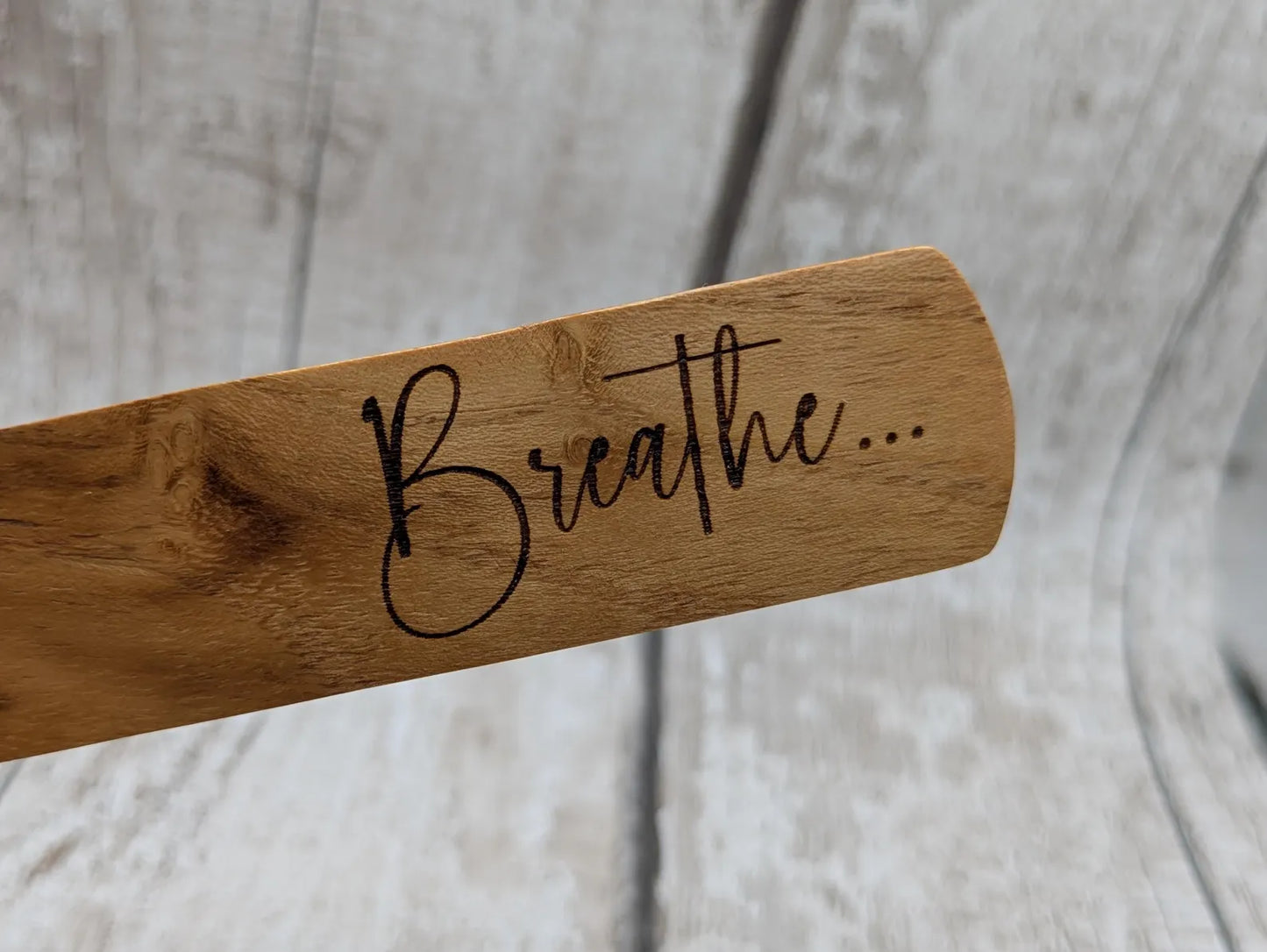 Handmade alder wooden laser printed breathe bookmark.
