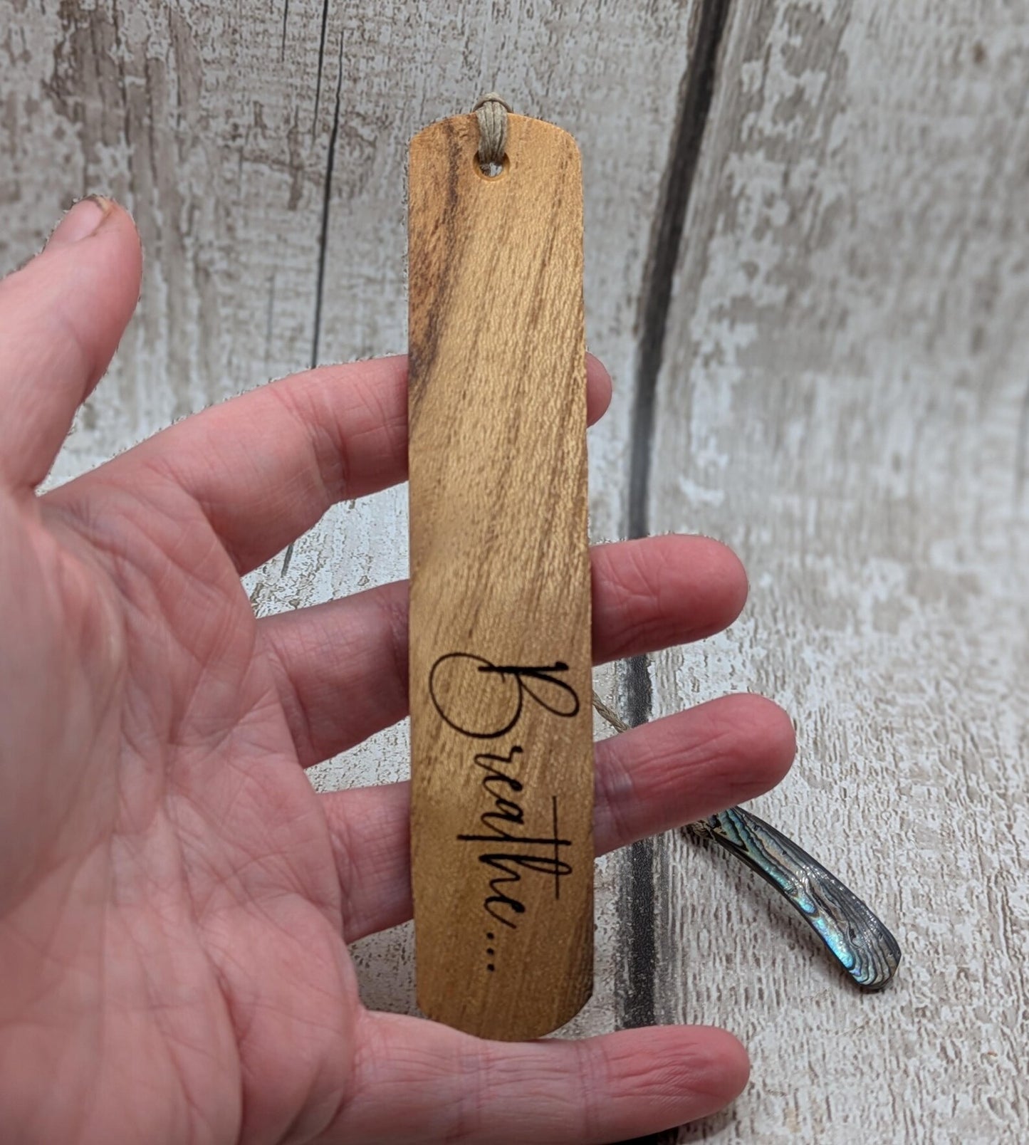Handmade Alder wood book mark with laser printed breathe mantra.