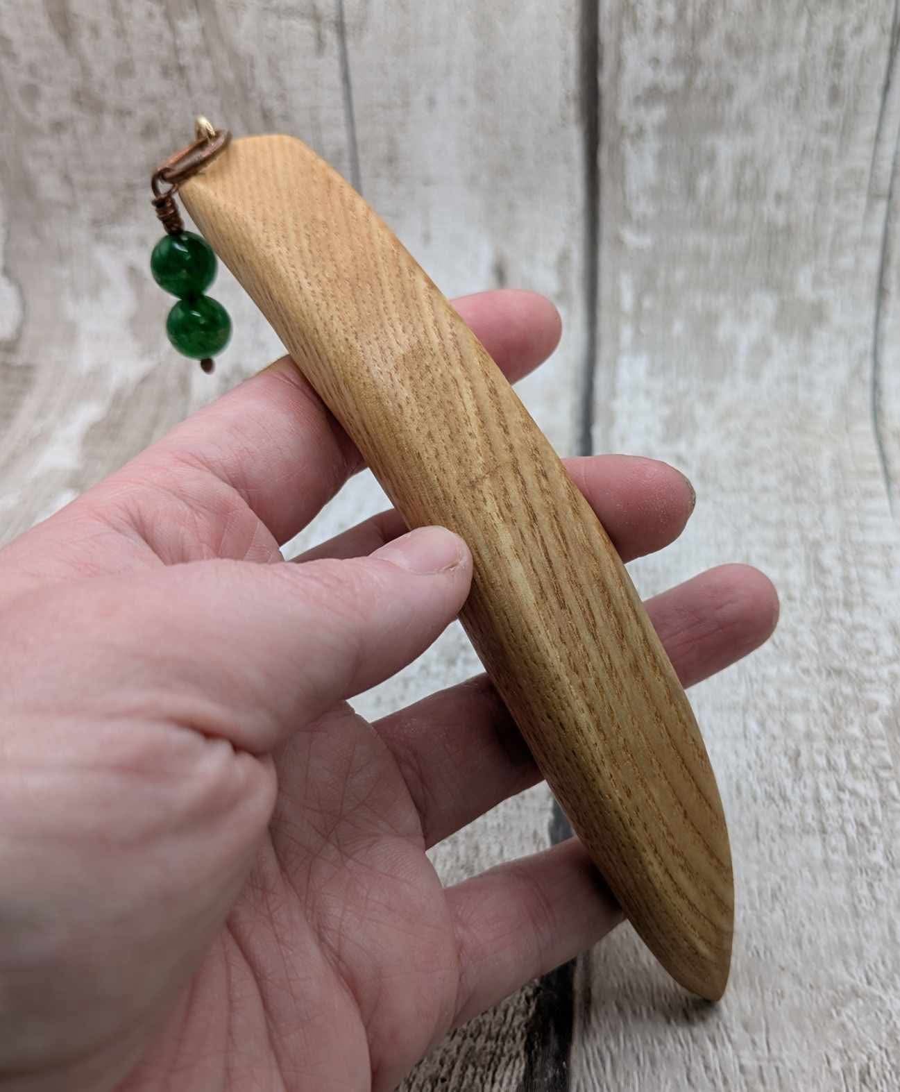 Oak wood curved hair stick with jade charm.