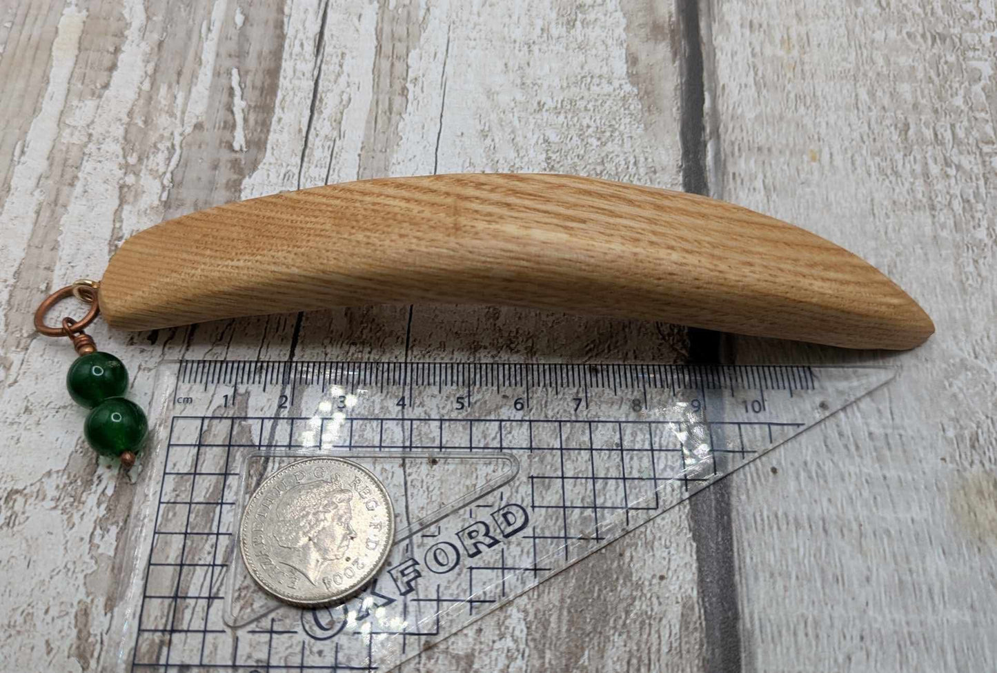 Oak wood curved hair stick with jade charm.