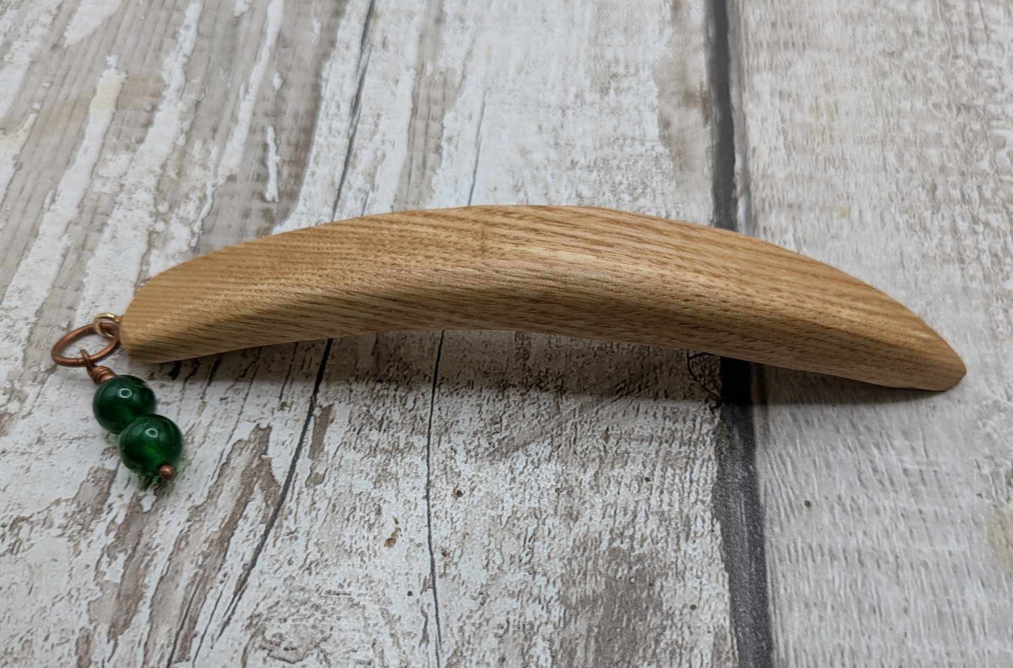 Oak wood curved hair stick with jade charm.