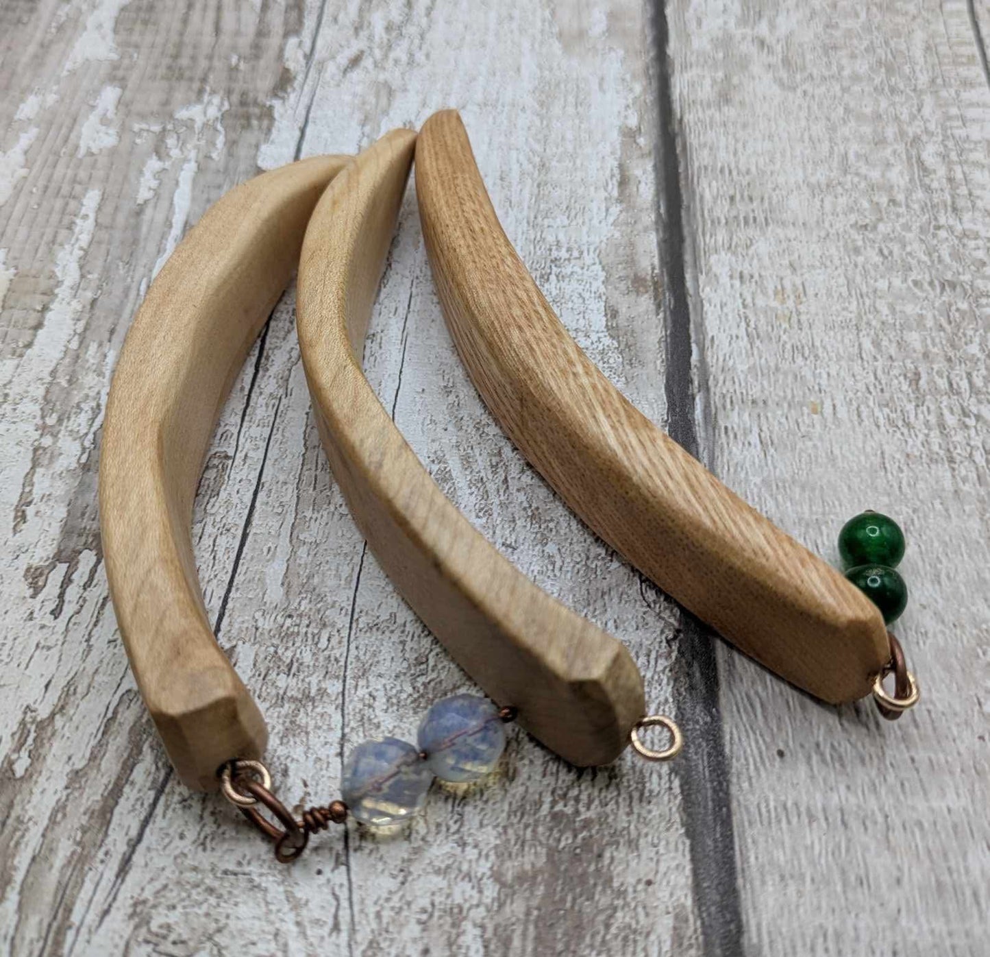 Oak wood curved hair stick with jade charm.