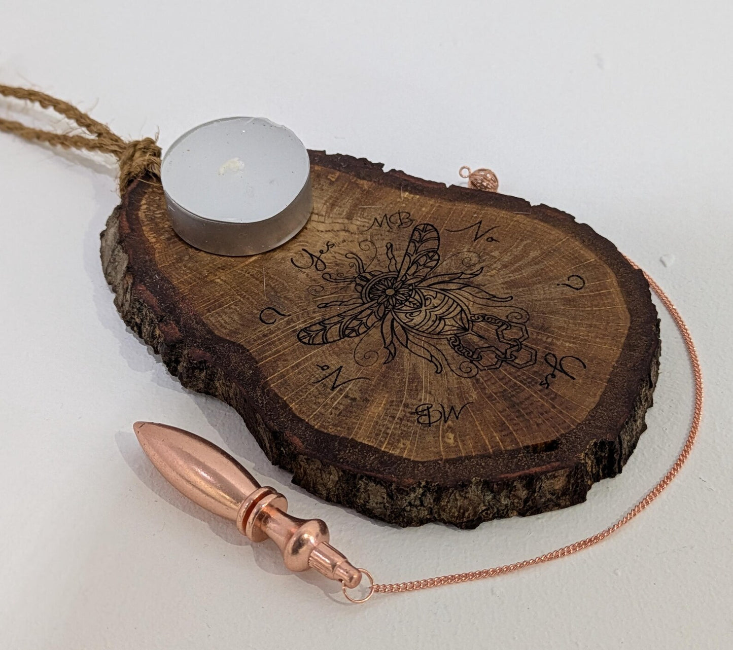 Oak wood slice with bumble bee detail, dowsing boards and incense holder.