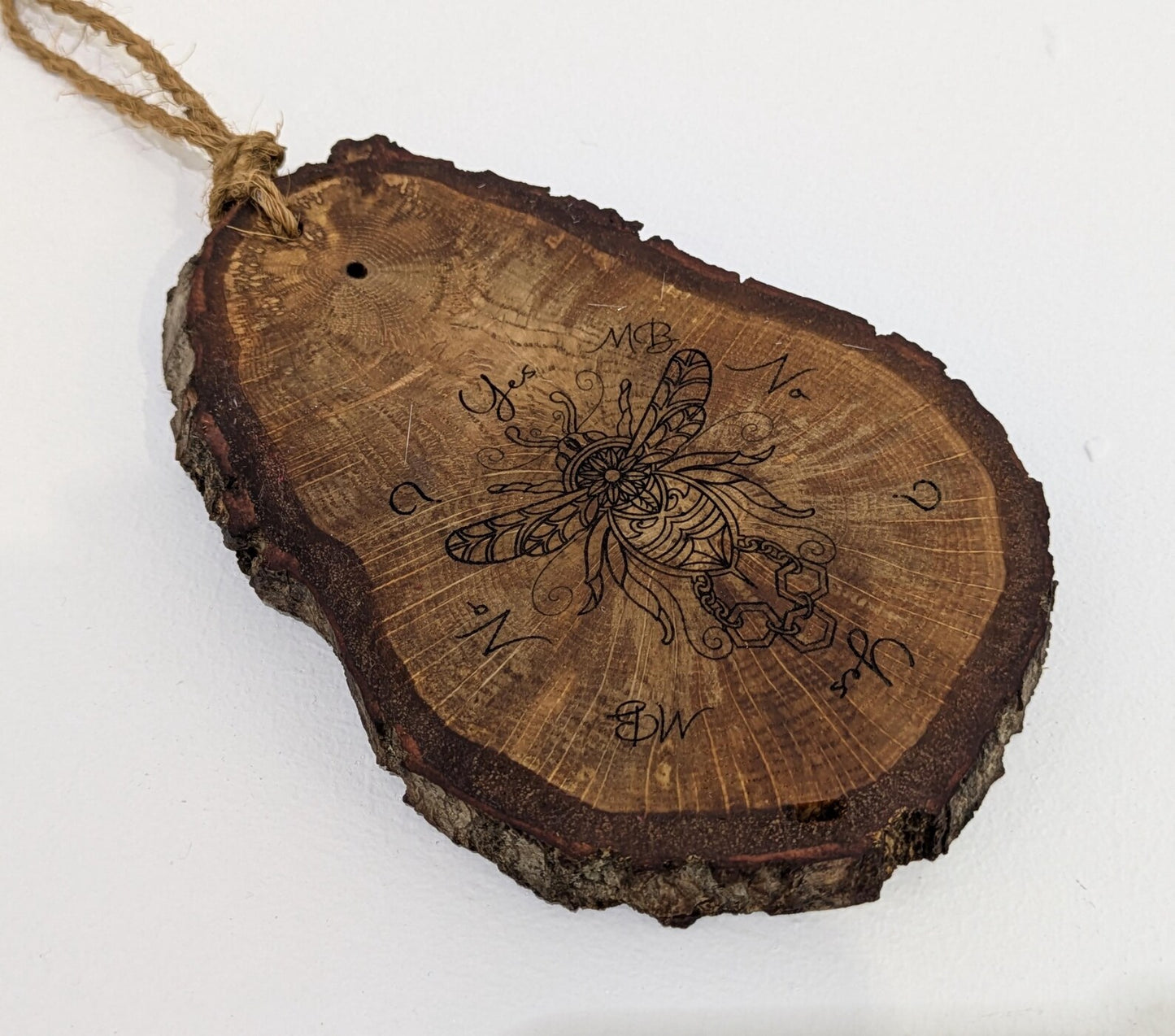 Oak wood slice with bumble bee detail, dowsing boards and incense holder.