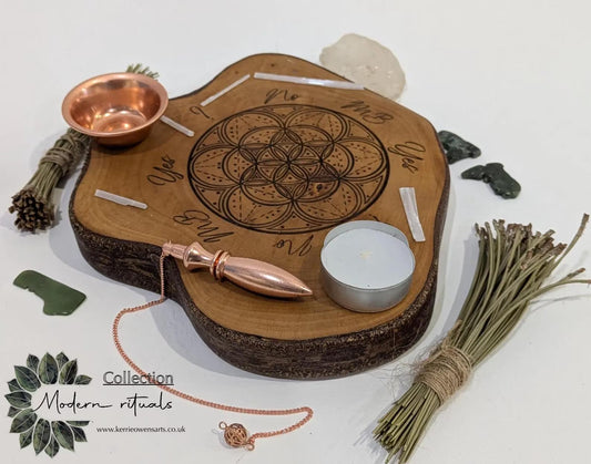 Random wood slice pendulum dowsing board with geometric laser print.
