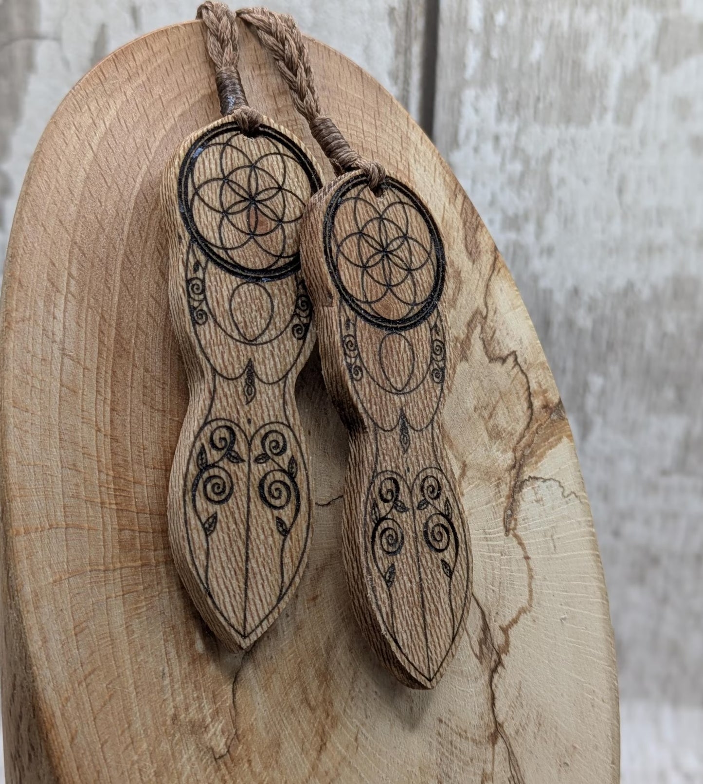 Recycled Lace wood, deity goddess 2d pendant holding the seed of life globe.
