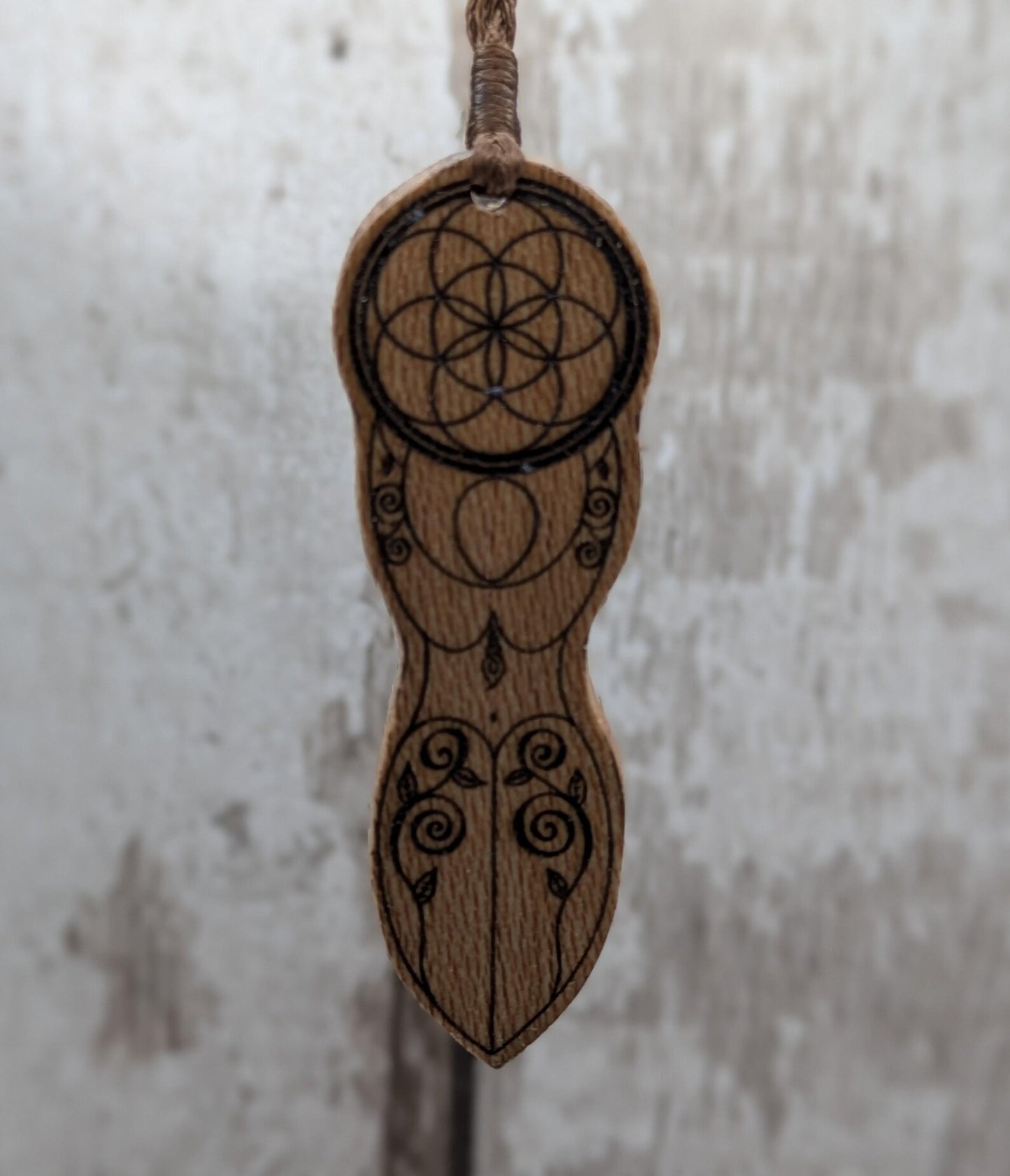 Recycled Lace wood, deity goddess 2d pendant holding the seed of life globe.