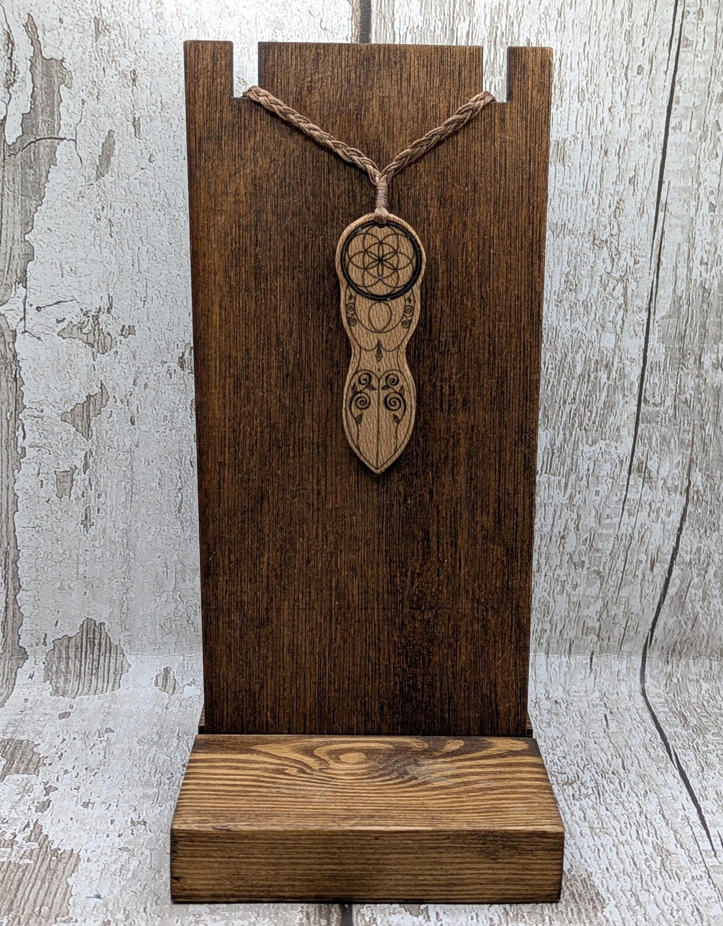 Recycled Lace wood, deity goddess 2d pendant holding the seed of life globe.