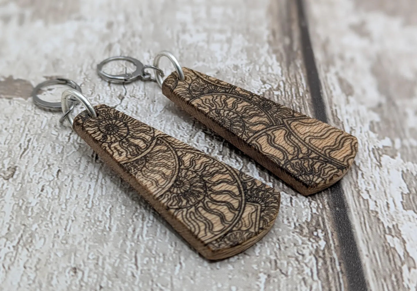 Lace wood Wooden roimata ammonite laser printed drop earrings with stainless steel findings.